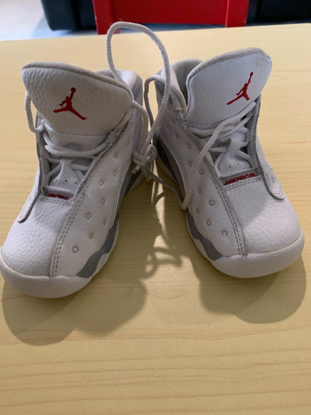 Jordan Kids White/Gray Sneakers with Red Jumpman 
Leather